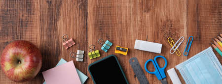 Back to school student design concept, top view of stationery over wooden table background with copy...