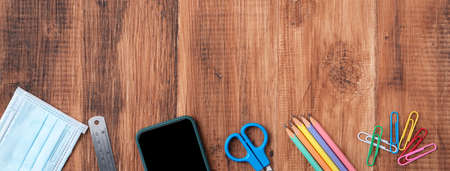Back to school student design concept, top view of stationery over wooden table background with copy space.の写真素材