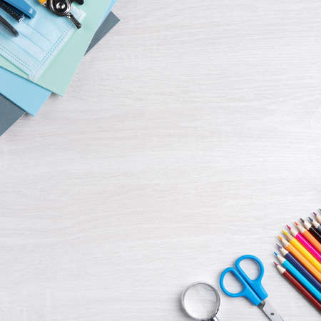 Back to school student design concept, top view of stationery over wooden table background with copy...