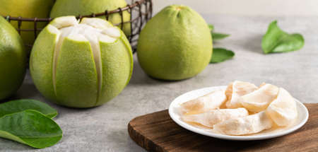 Fresh pomelo on gray cement background for Mid-Autumn Festival fruit.の写真素材