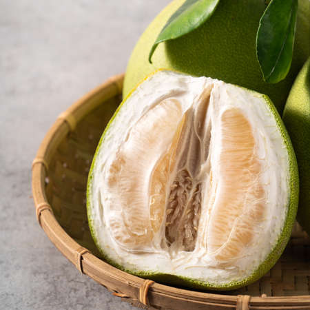 Fresh pomelo on gray cement background for Mid-Autumn Festival fruit.の写真素材