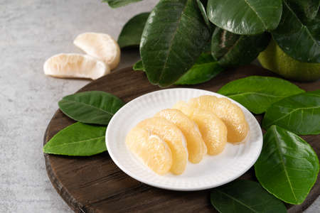 Fresh pomelo on gray cement background for Mid-Autumn Festival fruit.