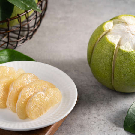 Fresh pomelo on gray cement background for Mid-Autumn Festival fruit.の写真素材
