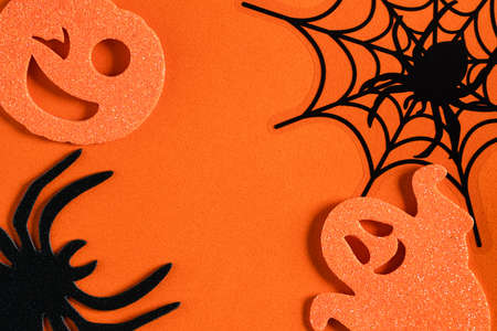 Top view of creative Halloween concept decoration on orange paper table background.の写真素材