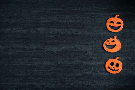 Top view of Halloween concept decoration non-woven fabric on dark black slate background.の写真素材