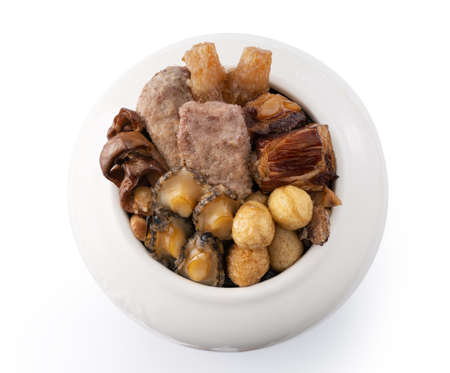 Traditional food of Chinese lunar new year, Buddha jumps over the wall, named Fo Tiao Qiang isolated on white background.の写真素材