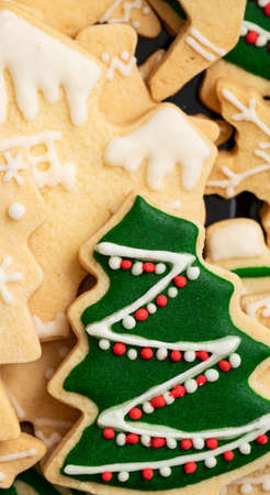 Top view of decorated green plain flavor gingerbread Christmas tree cookie with copy space, concept...