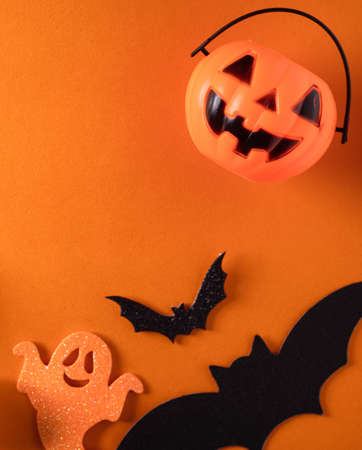 Top view of creative Halloween concept decoration on orange paper table background.の写真素材