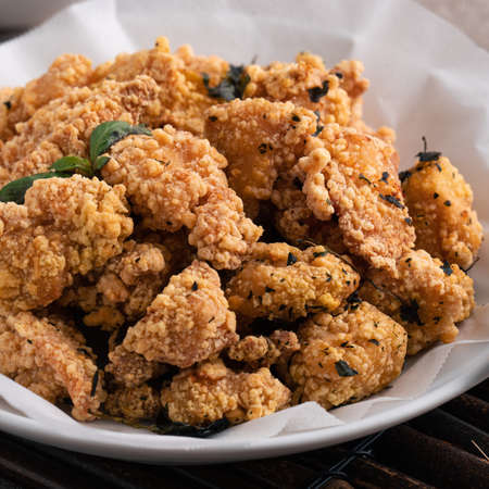 Close up of delicious fried popcorn chicken food in Taiwan for famous night market street food delicacy.の写真素材