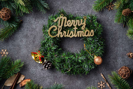 Top view of Christmas background design concept with fir tree branch, snowflake and pine cones.の写真素材
