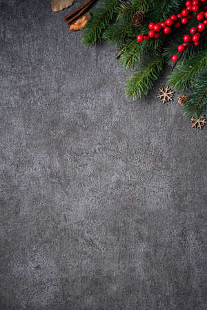 Top view of Christmas background design concept with fir tree branch, snowflake and pine cones.の写真素材