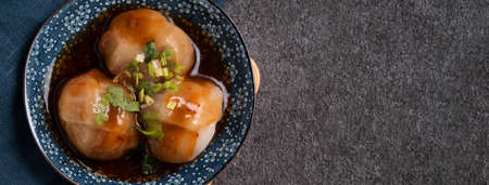 Top view of Bawan (Ba wan), Taiwanese meatball delicacy, delicious street food, steamed starch wrapped round shaped dumpling with pork and shrimp insideの写真素材
