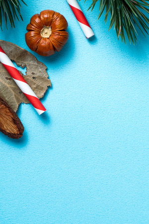 Top view of Christmas decorations background on blue table background with copy space, concept of holiday celebration.の写真素材