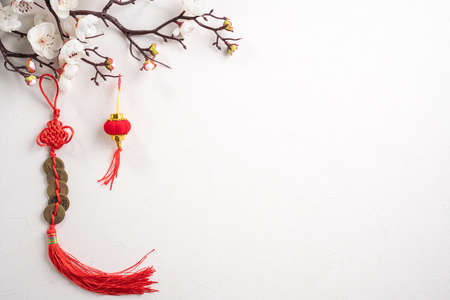 Top view of Chinese lunar new year background copy space design concept with white plum flower and festive decoration, the word inside picture means blessing.の写真素材