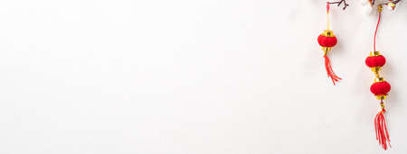 Top view of Chinese lunar new year background copy space design concept with white plum flower and festive decoration, the word inside picture means blessing.の写真素材