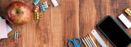 Back to school student design concept, top view of stationery over wooden table background with copy...
