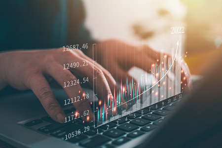 Concept of technology and business investment stock market finance with laptop, annual trading analysis.の写真素材
