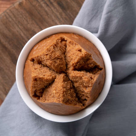 Top view of delicious fresh Chinese steamed sponge cake named Fa Gao for lunar new year festival traditional food over gray table background.の写真素材