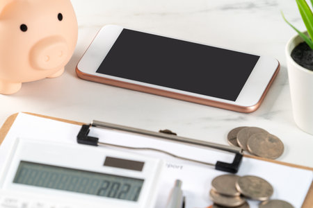 Design concept of annual summary analysis review report with calculator, saving, home finance calculating.の写真素材