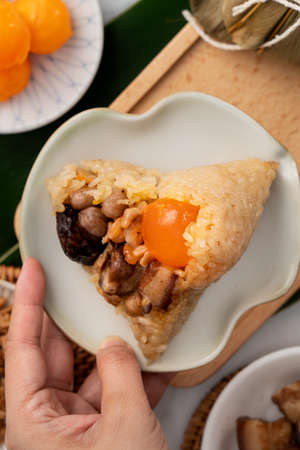 Zongzi. Rice dumpling for Chinese traditional Dragon Boat Festival (Duanwu Festival) on bright marble table background with ingredient.の写真素材