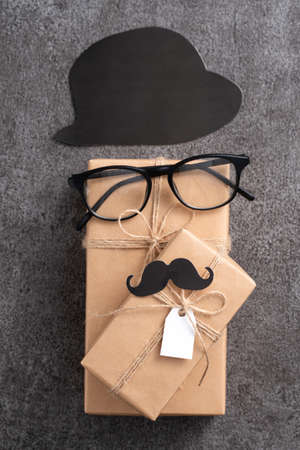Father's day background design concept. Top view of paper decoration ideas with gift box on gray table background.の写真素材