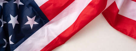 Concept of US Independence day or Memorial day. National flag over bright marble table background.