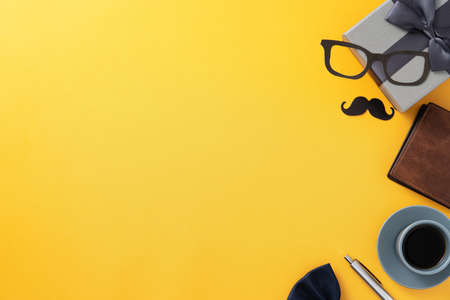 Father's day gift idea design concept with gift box on yellow background.の写真素材