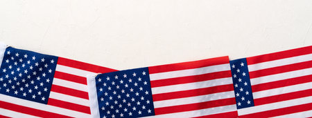 Concept of US Independence day or Memorial day. National flag over bright marble table background.