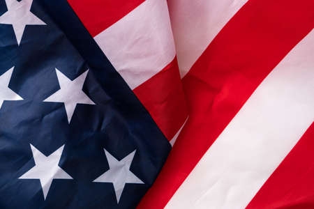 Concept of US Independence day or Memorial day. National flag over bright marble table background.