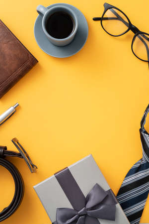 Father's day gift idea design concept with gift box on yellow background.の写真素材