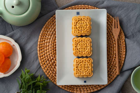 Delicious mung bean moon cake for Mid-Autumn Festival food mooncake on gray table background for...