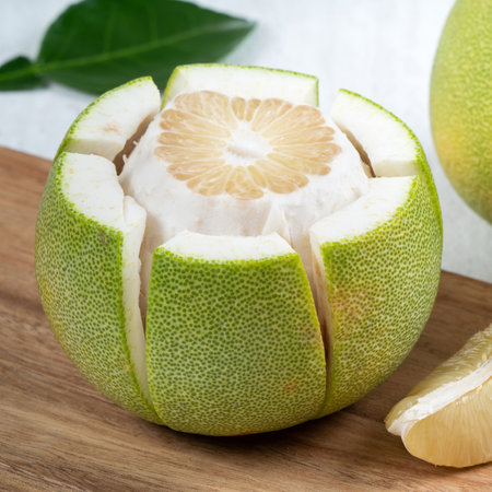 Close up of fresh peeled pomelo on white table background for Mid-Autumn Festival fruit.の写真素材