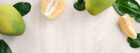 Top view of fresh peeled pomelo on bright wooden table background for Mid-Autumn Festival fruit.