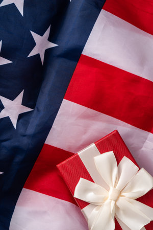 United States election design concept, top view of American Flag over white table background with gift box.の写真素材