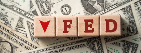 Wooden blocks with interest rate percent of bank with US dollars, financial world economy crisis design concept over blue table background.の写真素材