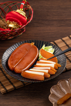 Delicious fresh mullet roe with white radish slices and garlic sprout for Chinese lunar new year...