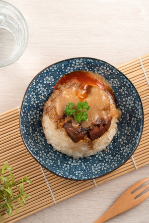 Migao, tube rice cake, rice pudding in a bowl topped with minced pork, delicious Taiwanese street food.の写真素材