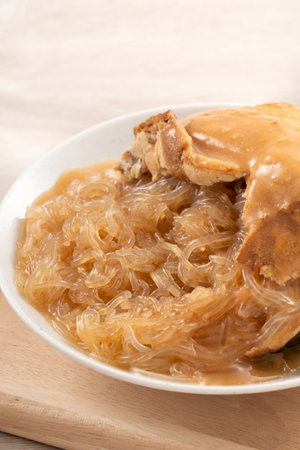 Tamsui agei (age, aburaage, ageh), delicious street food in Taiwan, stuffed with mung bean noodles and sauce topping.の写真素材