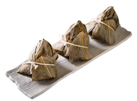 Zongzi, rice dumpling - Design concept of famous food in duanwu dragon boat festival with clipping path, cut out, isolated on white backgroundの写真素材