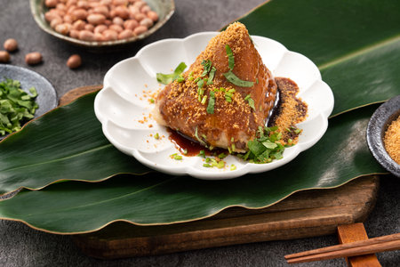 Vegetable zongzi. Vegetarian rice dumpling for traditional Chinese Duanwu Dragon Boat Festival food with glutinous rice, peanuts, and coriander.の写真素材