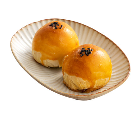 Close up of Moon cake yolk pastry, mooncake for Mid-Autumn Festival holiday isolated on white table background.の写真素材