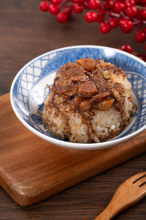 Migao, tube rice cake, rice pudding in a bowl topped with minced pork, delicious Taiwanese street food.の写真素材
