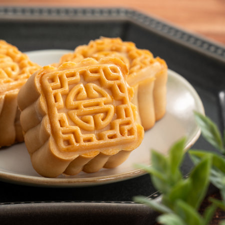 Delicious Cantonese moon cake for Mid-Autumn Festival food mooncake on wooden table background for afternoon tea, holiday celebration serving.の写真素材