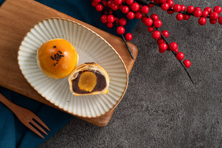 Moon cake yolk pastry, mooncake for Mid-Autumn Festival holiday on gray table backgroundの写真素材