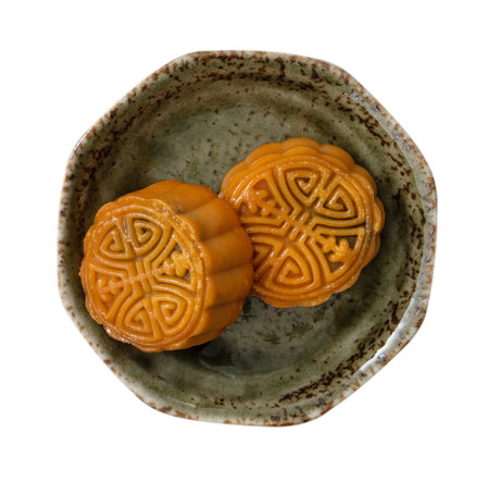 Delicious Cantonese moon cake for Mid-Autumn Festival food mooncake isolated on white background. Description: Delicious Cantonese moon cake for Mid-Autumn Festival food mooncake isolated on white background for afternoon tea, holiday celebration serving.の写真素材