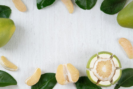 Top view of fresh peeled pomelo on white table background for Mid-Autumn Festival fruit.の写真素材