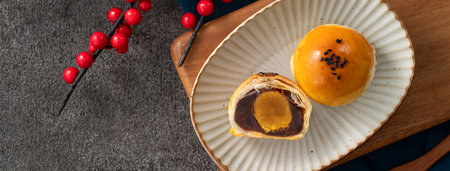 Moon cake yolk pastry, mooncake for Mid-Autumn Festival holiday on gray table backgroundの写真素材