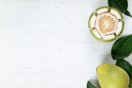 Top view of fresh peeled pomelo on white table background for Mid-Autumn Festival fruit.の写真素材