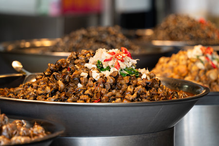 Stir-fried spicy flavored snail meat, delicious traditional street food in Taiwan.の写真素材