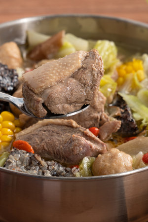 Delicious ginger duck stew hot pot soup with fresh vegetables in Taiwan.の写真素材